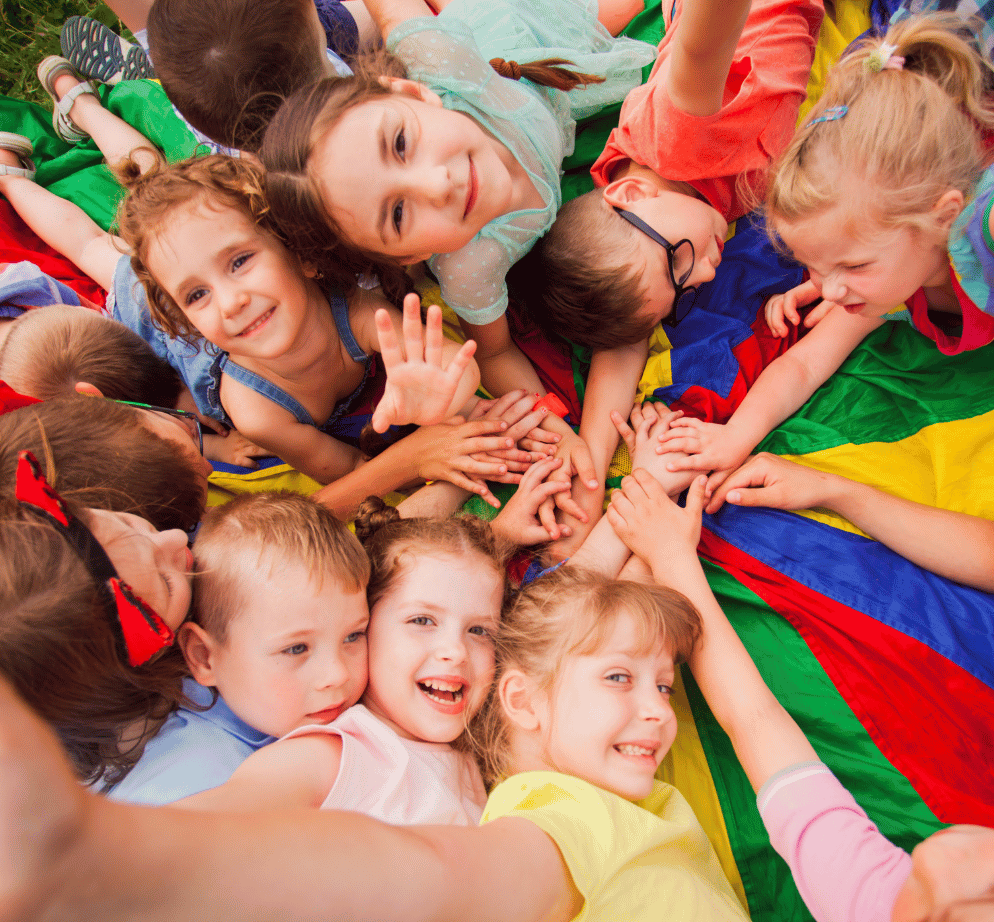 school-age children participating in summer camp group activity